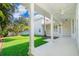 Covered patio with ceiling fan and large manicured lawn at 204 Celebration Blvd, Celebration, FL 34747