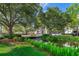 Scenic pond with lush greenery, and a bridge, perfect for enjoying nature and tranquility at 204 Celebration Blvd, Celebration, FL 34747