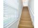 Bright staircase with light wood treads and a large window letting in natural light at 204 Celebration Blvd, Celebration, FL 34747