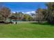 Well-maintained tennis court and picnic area surrounded by lush greenery, ideal for outdoor recreation at 204 Celebration Blvd, Celebration, FL 34747