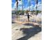 enjoying a playful splash in an interactive water fountain on a sunny day at 204 Celebration Blvd, Celebration, FL 34747