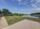 Peaceful backyard patio with tranquil water views, ideal for relaxation and enjoying nature at 2150 Emperor Dr., Kissimmee, FL 34744
