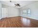 Bedroom featuring hardwood floors and windows that provides natural light and a pool view at 2150 Emperor Dr., Kissimmee, FL 34744