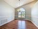Bright dining room with vaulted ceiling, chandelier, and large arched window at 2150 Emperor Dr., Kissimmee, FL 34744