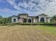 Stunning home with a well-manicured lawn and beautiful landscaping creating great curb appeal at 2150 Emperor Dr., Kissimmee, FL 34744