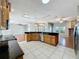 Open kitchen featuring a tile floor, granite countertops, and stainless steel appliances at 2150 Emperor Dr., Kissimmee, FL 34744
