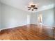 View of spacious living room featuring hardwood floors and showing a view of the bathroom at 2150 Emperor Dr., Kissimmee, FL 34744
