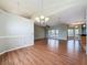 Open-concept living space with vaulted ceiling and wood flooring throughout at 2150 Emperor Dr., Kissimmee, FL 34744
