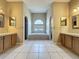 Bathroom showcasing tiled shower, large garden tub, and double vanities at 2150 Emperor Dr., Kissimmee, FL 34744