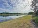 Picturesque pond bordered by lush greenery, offering a serene and scenic view at 2150 Emperor Dr., Kissimmee, FL 34744