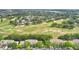 Aerial showcases lush golf course community with green fairways, mature trees and beautiful homes at 2473 Saint Augustine Blvd, Haines City, FL 33844