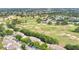 Expansive aerial view of a golf course community with lush green fairways and mature trees surrounding well-maintained homes at 2473 Saint Augustine Blvd, Haines City, FL 33844