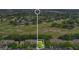 Aerial view highlighting the property's location within a golf course community surrounded by lush greenery and scenic views at 2473 Saint Augustine Blvd, Haines City, FL 33844