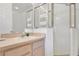 Clean bathroom with a glass-enclosed shower, vanity, and neutral color palette at 2473 Saint Augustine Blvd, Haines City, FL 33844