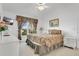 Well-lit bedroom with neutral tones, a window view, and comfortable, inviting décor at 2473 Saint Augustine Blvd, Haines City, FL 33844