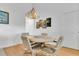 Comfortable dining area with chandelier and seating for four at 2473 Saint Augustine Blvd, Haines City, FL 33844