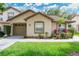 Charming single-story home featuring a well-manicured lawn and a cozy front porch at 2473 Saint Augustine Blvd, Haines City, FL 33844
