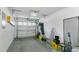 Spacious garage with door, ample storage, and convenient access to home essentials at 2473 Saint Augustine Blvd, Haines City, FL 33844