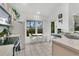 Bright kitchen showcasing neutral cabinets, tiled floors, and a cozy breakfast nook at 2473 Saint Augustine Blvd, Haines City, FL 33844