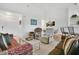 Open-concept layout that shows the living room, dining area, and a glimpse of the kitchen at 2473 Saint Augustine Blvd, Haines City, FL 33844