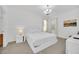 This bedroom features a bright interior, a white platform bed, and ample natural light at 2628 Tranquility Way, Kissimmee, FL 34746