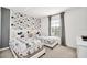 Cozy bedroom with twin beds, Mickey Mouse-themed decor, and natural light at 2628 Tranquility Way, Kissimmee, FL 34746