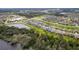 Birds eye view of the property, lake, and the surrounding residential neighborhood at 3138 Dark Sky Dr, St Cloud, FL 34773