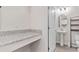 Powder room features granite counters, pedestal sink, and wood-look floors at 3138 Dark Sky Dr, St Cloud, FL 34773