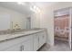 Bathroom with double granite vanity sinks and decorative shower curtain at 3138 Dark Sky Dr, St Cloud, FL 34773