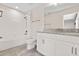 Well-lit bathroom features a tiled floor, shower, and vanity with granite countertops at 3138 Dark Sky Dr, St Cloud, FL 34773