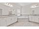 Bathroom features dual sinks, granite counters, soaking tub, and glass-enclosed shower at 3138 Dark Sky Dr, St Cloud, FL 34773