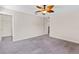 Bedroom featuring neutral walls, grey carpet, and a ceiling fan at 3138 Dark Sky Dr, St Cloud, FL 34773