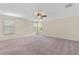 Large bedroom with windows providing ample natural light and a ceiling fan at 3138 Dark Sky Dr, St Cloud, FL 34773