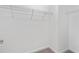 Walk-in closet featuring white walls and wire shelving for ample storage at 3138 Dark Sky Dr, St Cloud, FL 34773