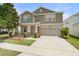 Charming two-story home with landscaped yard, neutral paint and attached two car garage at 3138 Dark Sky Dr, St Cloud, FL 34773