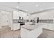 Bright kitchen features granite countertops, stainless appliances and large center island at 3138 Dark Sky Dr, St Cloud, FL 34773