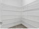 Spacious pantry with custom shelving for organizing and easy storage at 3138 Dark Sky Dr, St Cloud, FL 34773