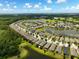 Scenic aerial view showcases a community with winding roads, tranquil ponds, and a golf course at 3428 Sagebrush St, St Cloud, FL 34773