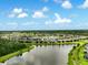 Expansive community with homes surrounding tranquil ponds and lush greenery, creating a serene environment at 3428 Sagebrush St, St Cloud, FL 34773