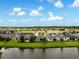 Picturesque view of homes surrounding a peaceful pond with lush greenery and serene waters at 3428 Sagebrush St, St Cloud, FL 34773