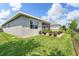 Expansive backyard featuring lush green lawn, brick paved patio, and screened in porch at 3428 Sagebrush St, St Cloud, FL 34773