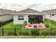 Charming backyard patio with brick pavers, Adirondack chairs, and a fire pit, perfect for outdoor relaxation at 3428 Sagebrush St, St Cloud, FL 34773