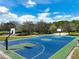 Outdoor basketball court with vibrant colors and well-maintained surface at 3428 Sagebrush St, St Cloud, FL 34773