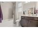 Bathroom with shower-tub combo, stylish vanity with white countertops and dark brown cabinetry at 3428 Sagebrush St, St Cloud, FL 34773