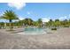 Beautiful community pool with a spacious deck area, surrounded by lounge chairs and palm trees at 3428 Sagebrush St, St Cloud, FL 34773