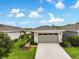 Charming single-story home featuring a neutral color scheme, well-manicured lawn, and a two-car garage at 3428 Sagebrush St, St Cloud, FL 34773