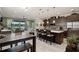 Modern kitchen with stainless steel appliances, a center island, and an open floor plan to dining and living area at 3428 Sagebrush St, St Cloud, FL 34773