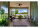 Covered patio with beautiful lake view, with brick pavers, seating, and ceiling fan at 3428 Sagebrush St, St Cloud, FL 34773