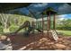 Community playground with playhouse and multiple slides, perfect for of all ages at 3428 Sagebrush St, St Cloud, FL 34773