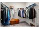 Organized walk-in closet featuring ample hanging space, shelving, and a wooden chest for additional storage at 3428 Sagebrush St, St Cloud, FL 34773